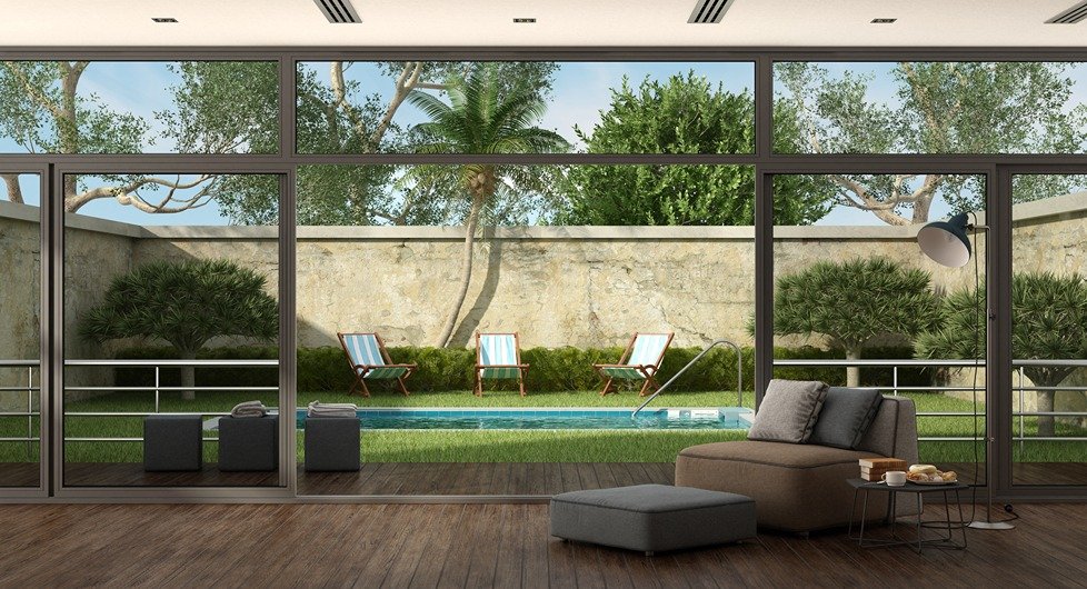 Paver Patio Contractor project featuring an outdoor patio and pool area beside a modern home