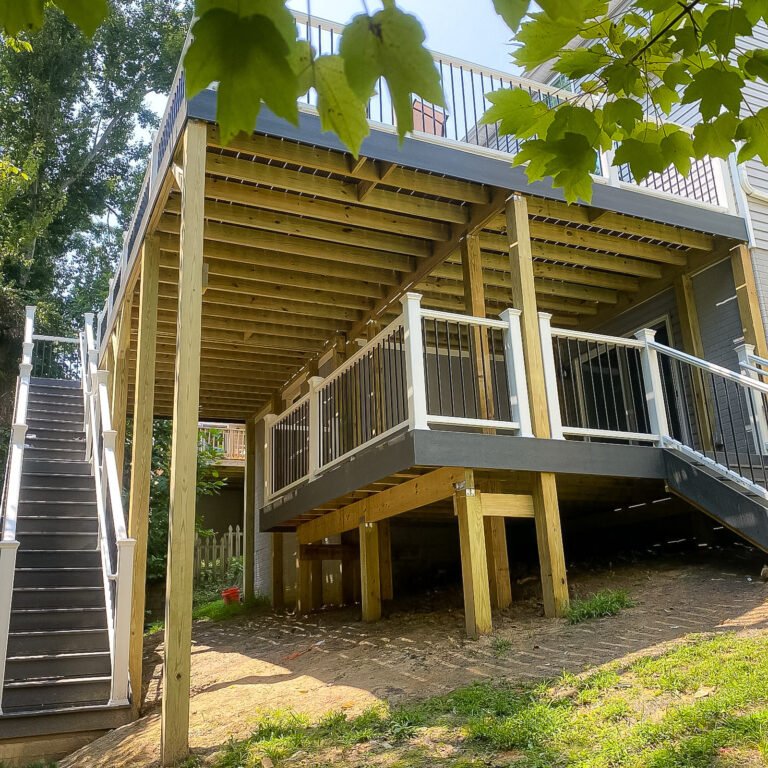 Two-story deck with connecting stairs and contrasting railings at a Williamsburg home