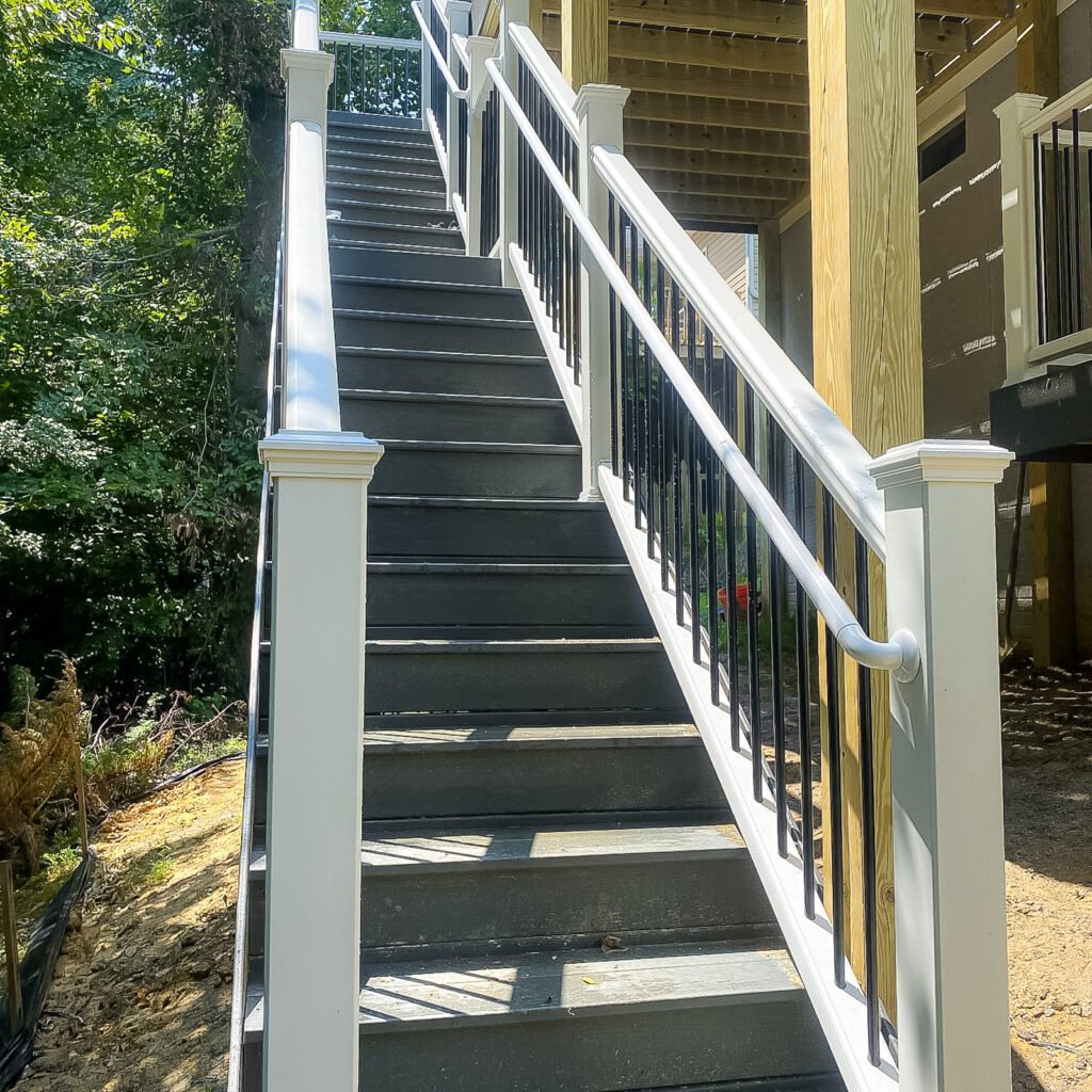 Second Story Deck Builder project featuring an elevated deck addition on a Williamsburg home