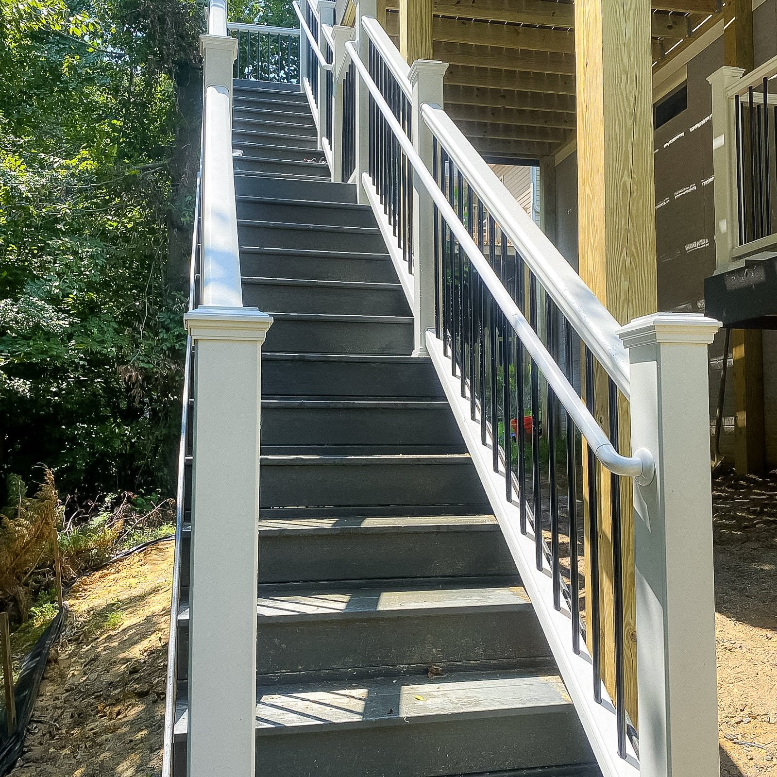 Second Story Deck Builder project featuring an elevated deck addition on a Williamsburg home