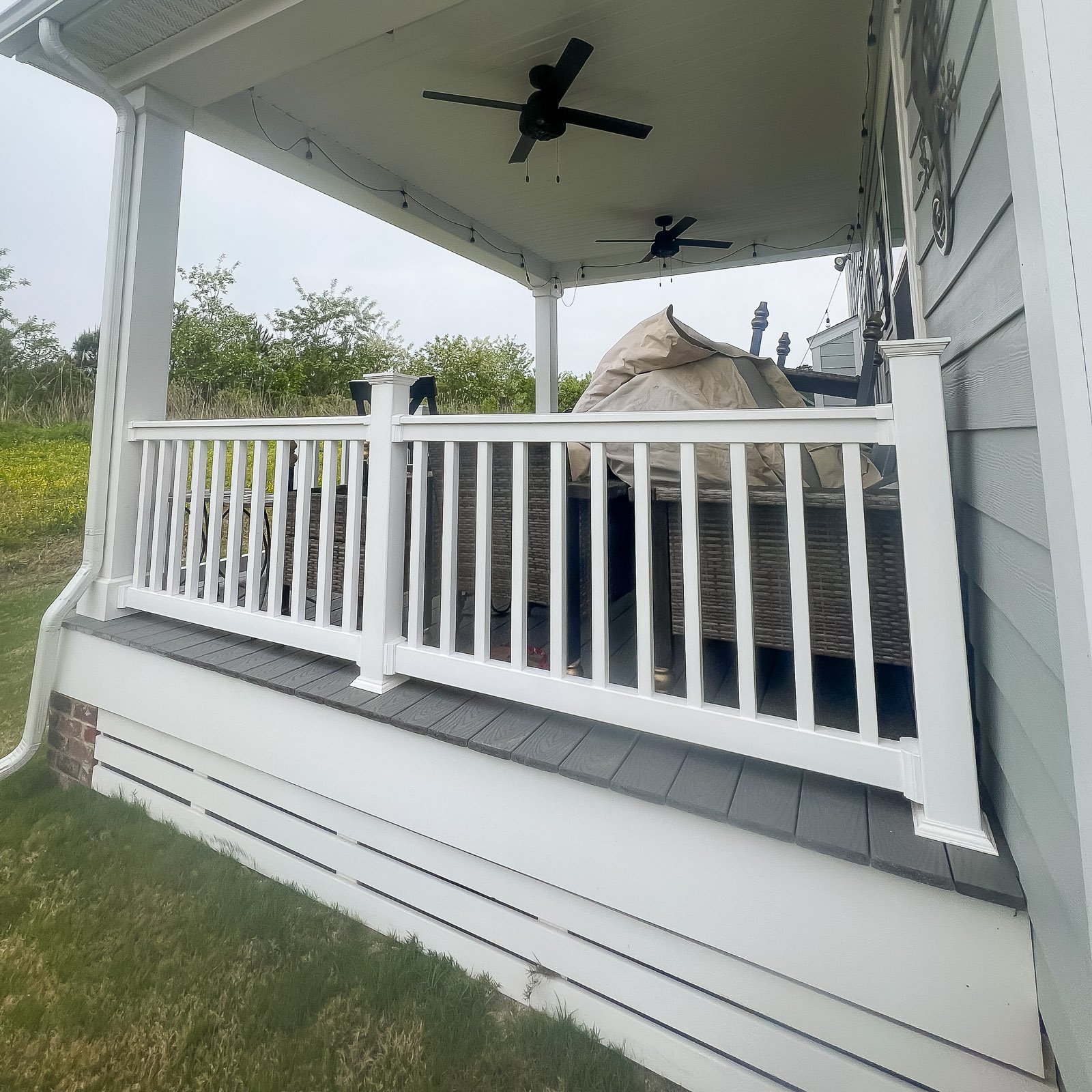 Back Porch Builder project featuring a completed back porch and composite deck in Chesapeake