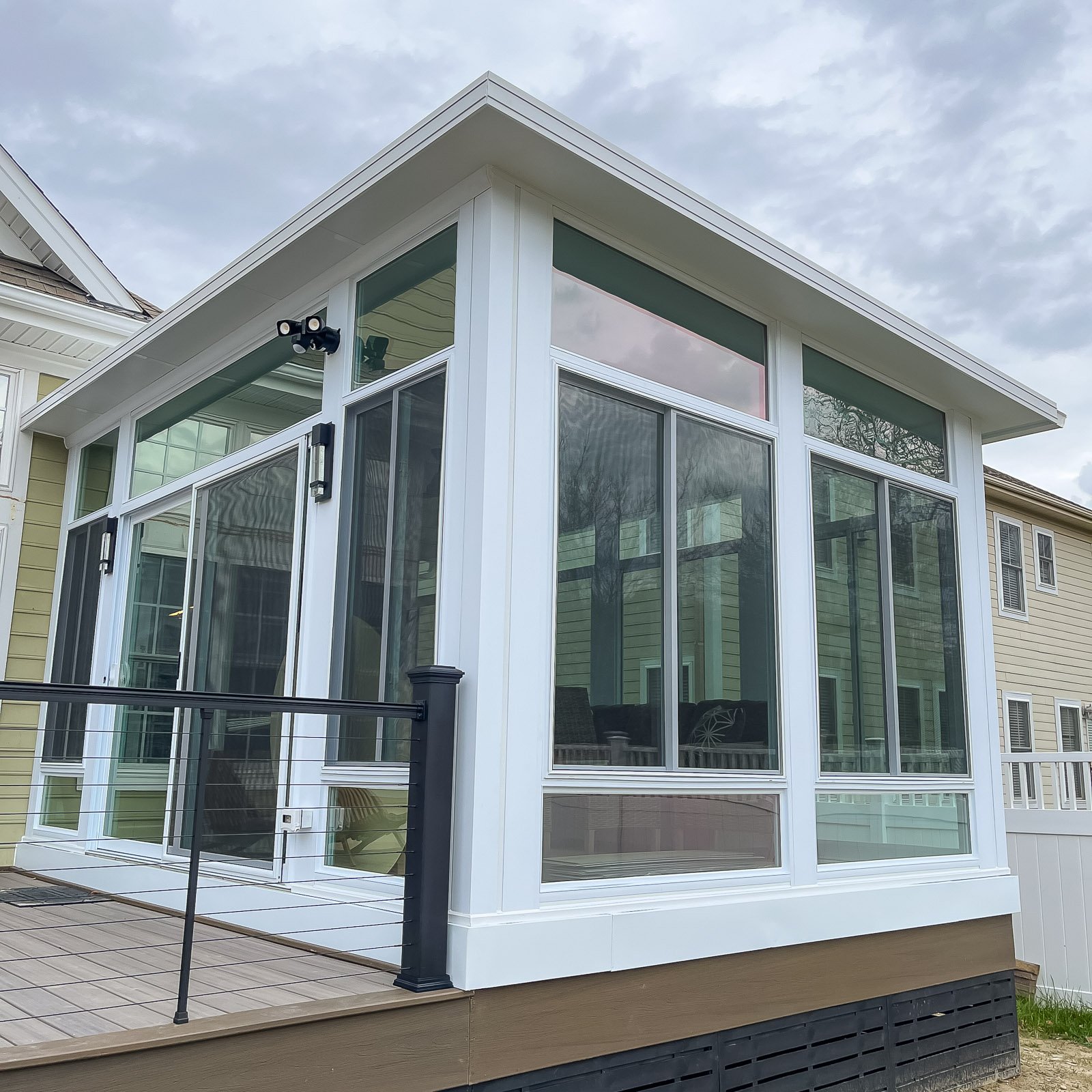 Four Season Sunroom Builder project featuring a completed four season sunroom addition in Hampton Roads