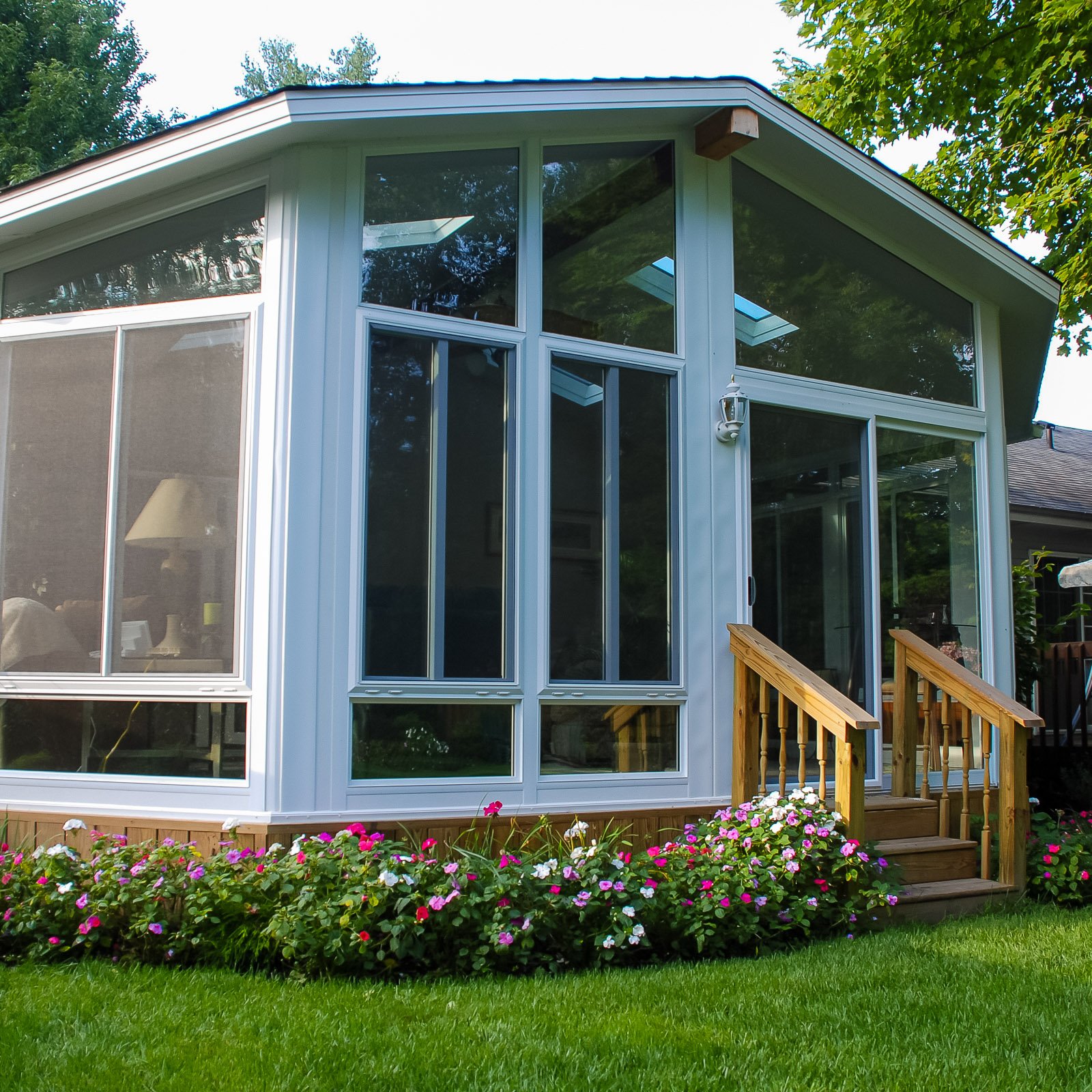 Glass Sunroom Builder project featuring a completed glass gable sunroom addition in Hampton Roads