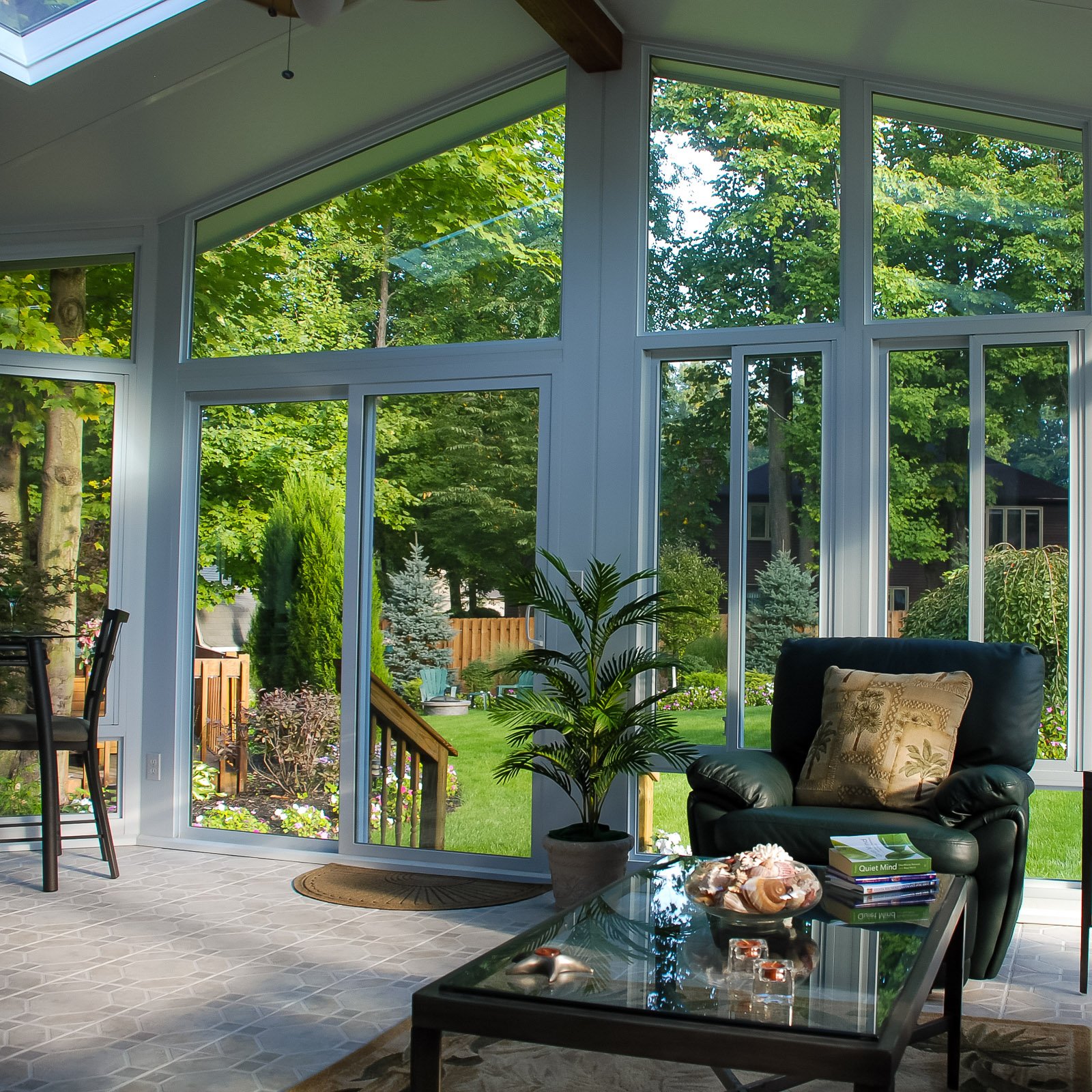 Glass gable sunroom with large windows by an Outdoor Living Contractor in Hampton Roads