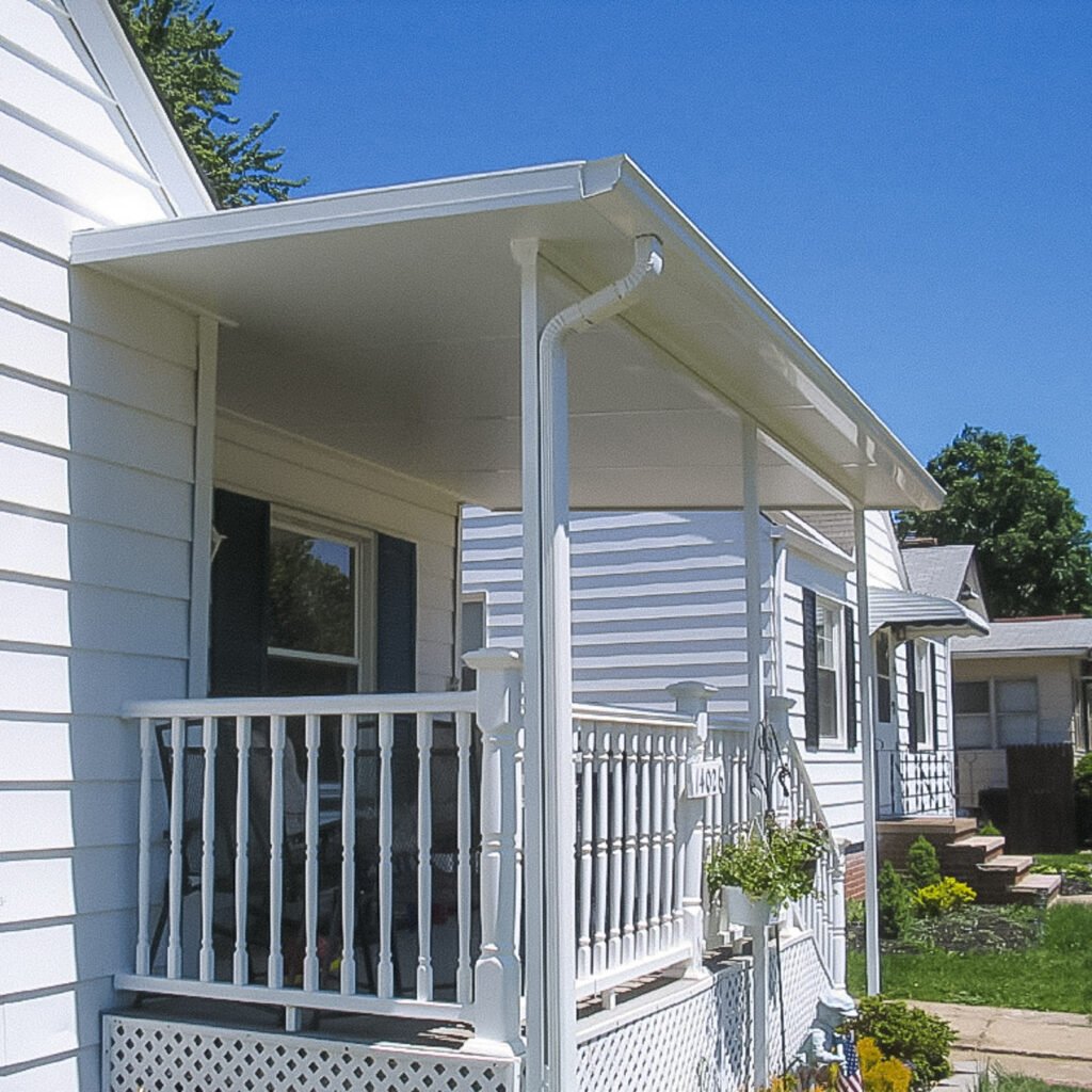 Attached patio cover providing backyard shade by an Outdoor Living Contractor in Carrollton