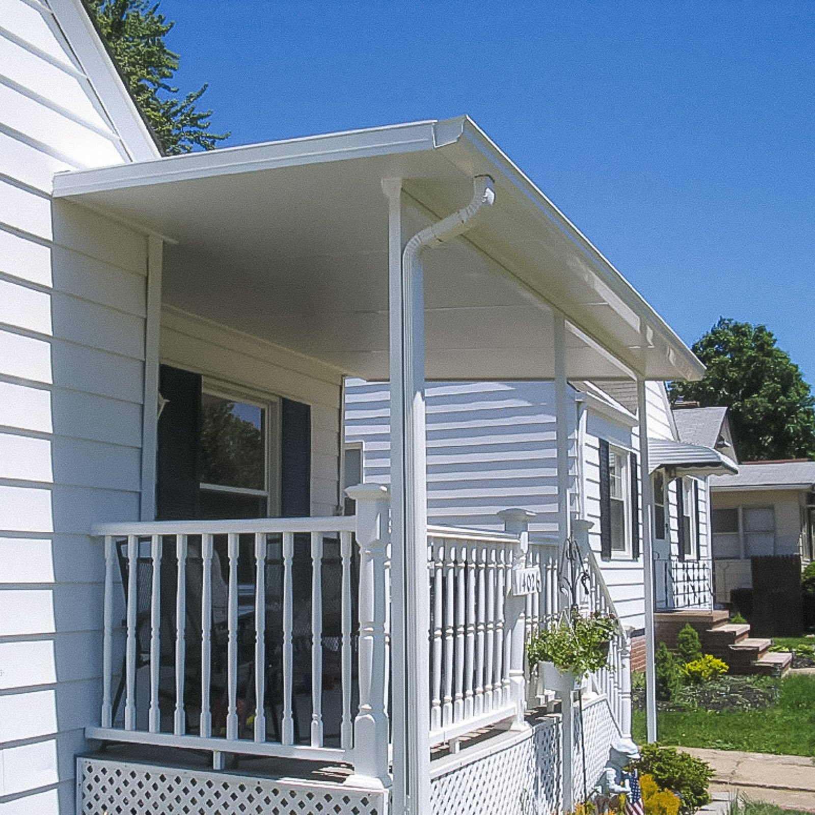 Attached patio cover providing backyard shade by an Outdoor Living Contractor in Carrollton