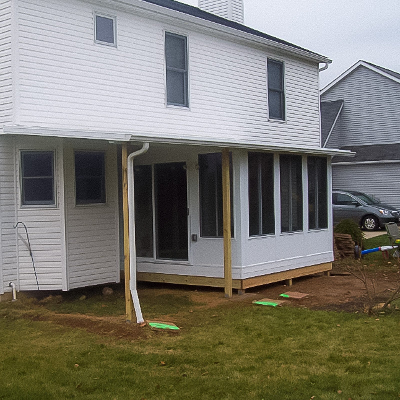 Porch and Patio Enclosure Contractor project featuring a three season porch enclosure with an attached patio cover
