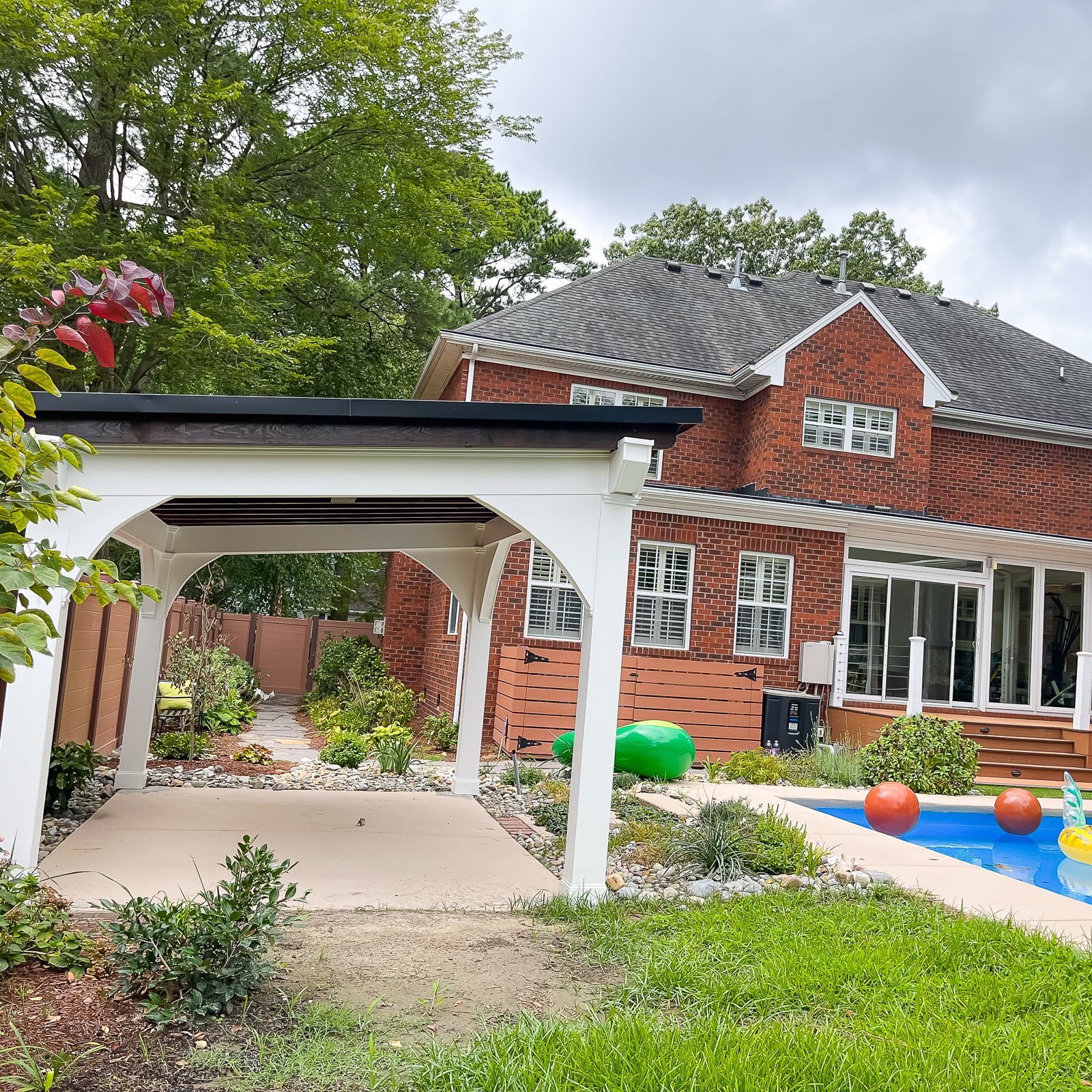 Patio Cover and Outdoor Structure Builder project featuring an outdoor porch and patio shade structure in Norfolk
