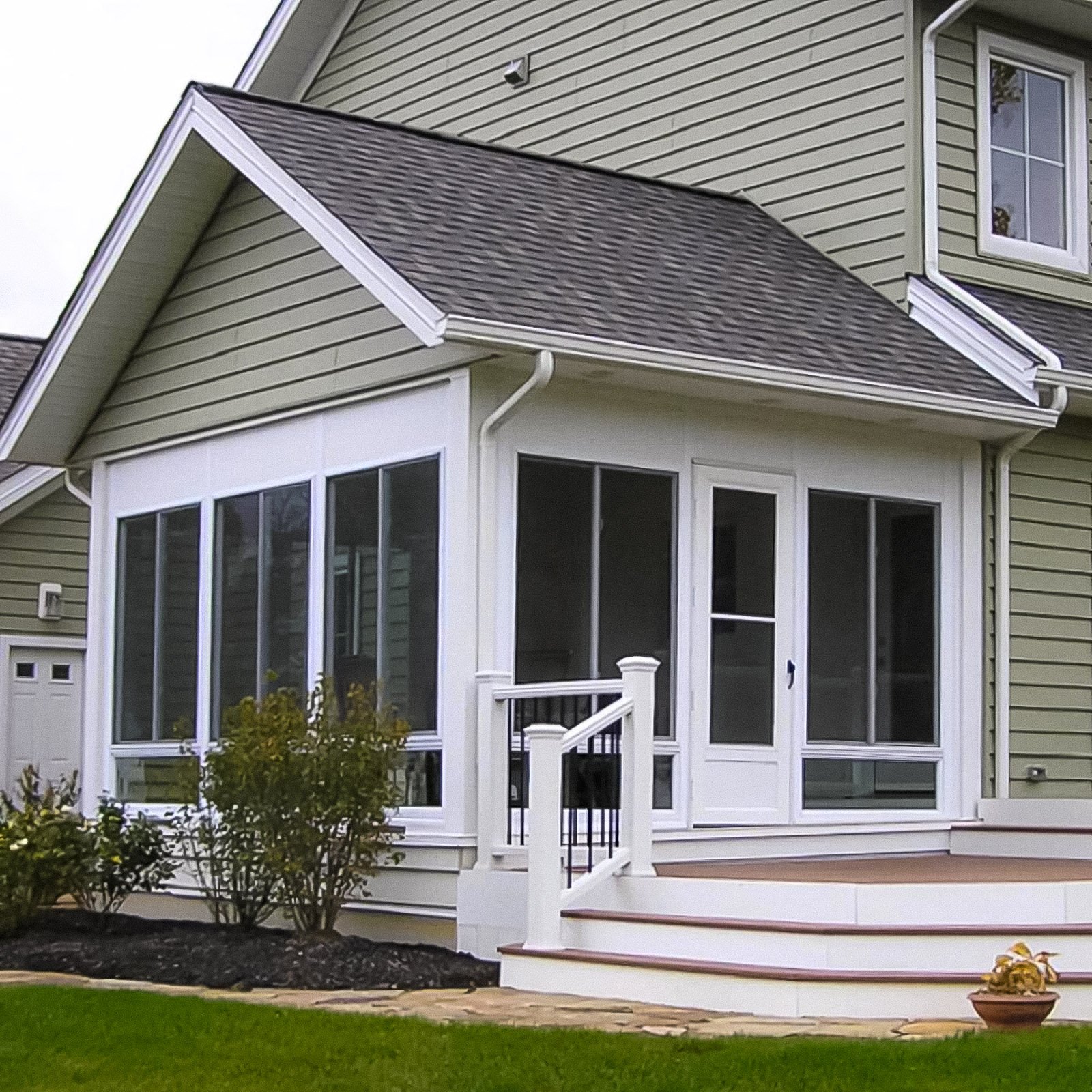 Custom Screen Room Builder project featuring a screened porch enclosure beneath an existing gable roof