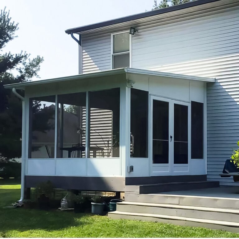 Covered Screen Room Builder project featuring a covered screen room with a white aluminum roof and exterior door