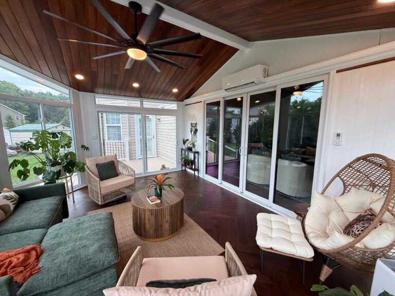 Furnished sunroom with a wood ceiling and garden views